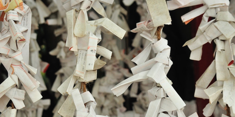 Folded paper hangs down from the ceiling. There are rows of paper