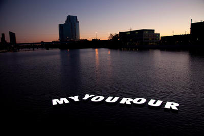 Image of larger body of water at sunset with white text that reads myyourour