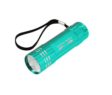 teal compact flashlight on white background