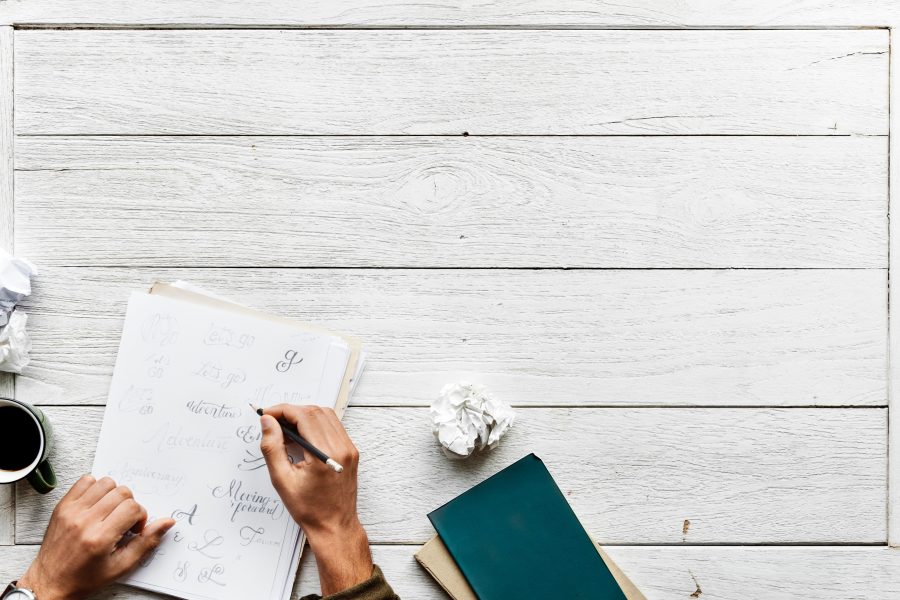 Image of person writing a letter