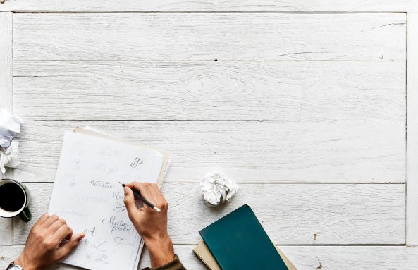 Image of person writing a letter