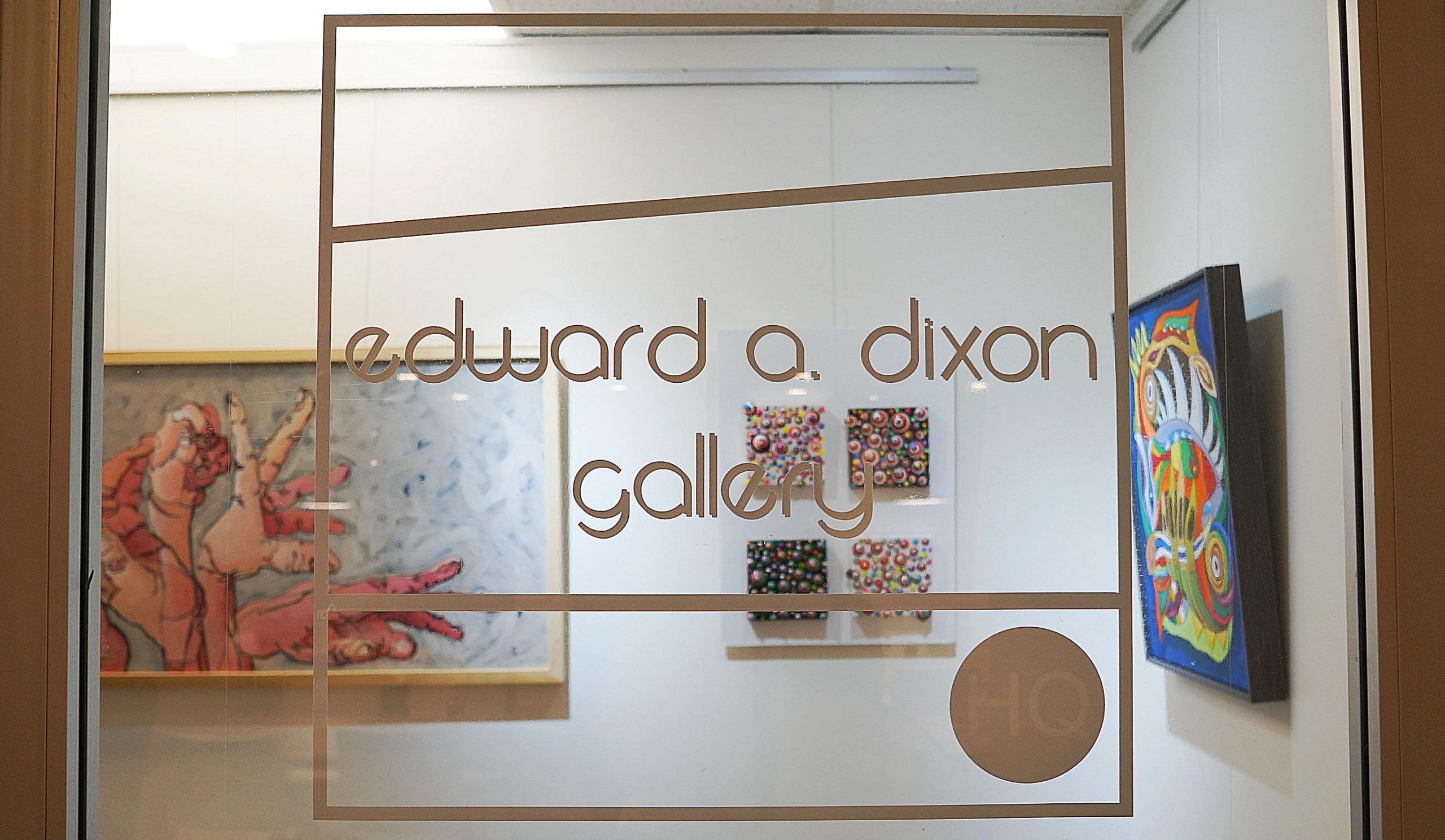 Image of the window of the Edward A Dixong Gallery. Their logo displays showing the gallery name