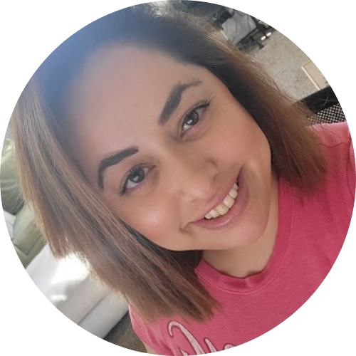 headshot of Natalie Villa wearing a pink shirt