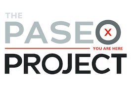 Logo for The Paseo Project that is shown in gray and black text. There is also red text that reads 