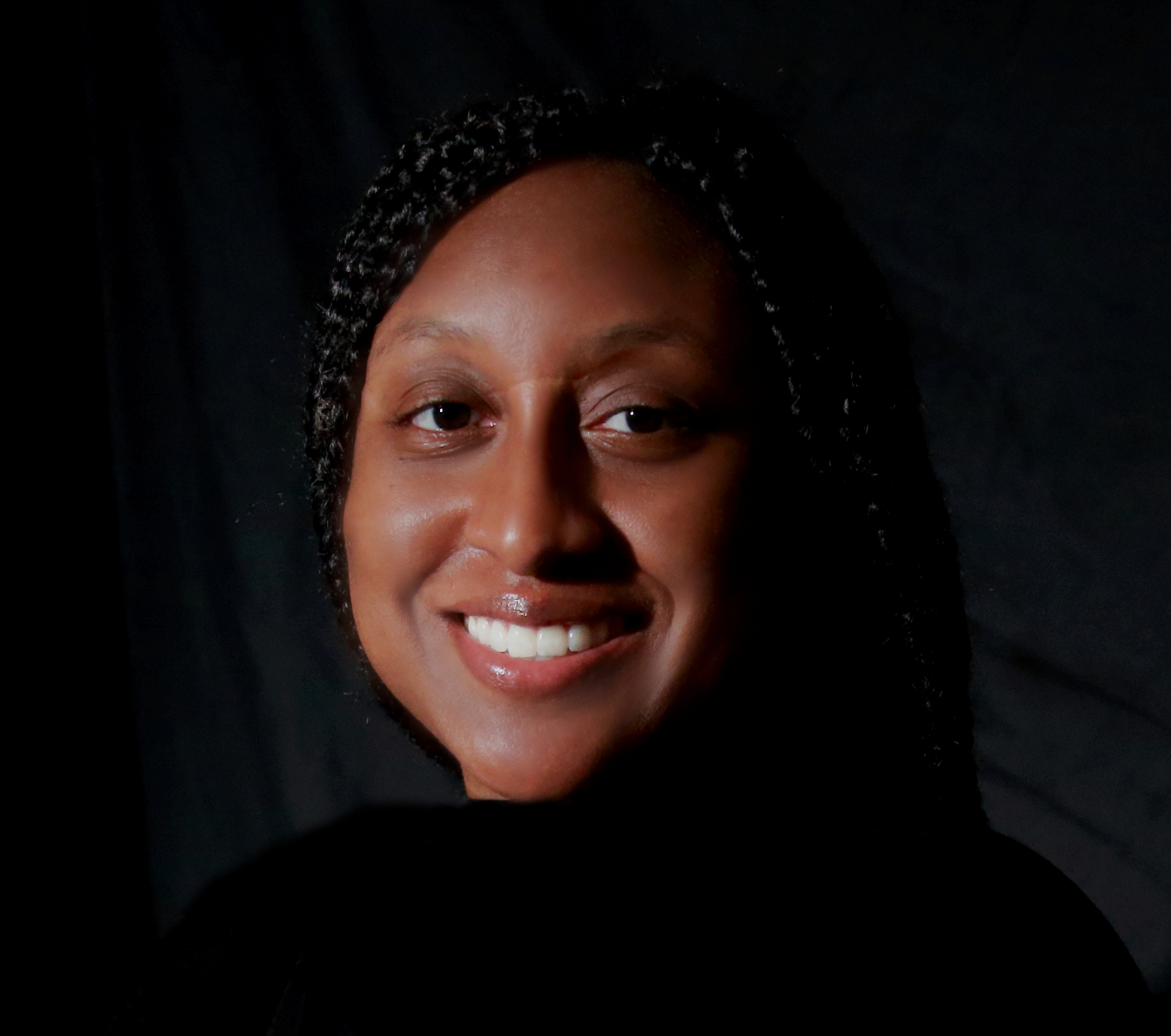 Headshot of Brittany Alston in front of a black backdrop.