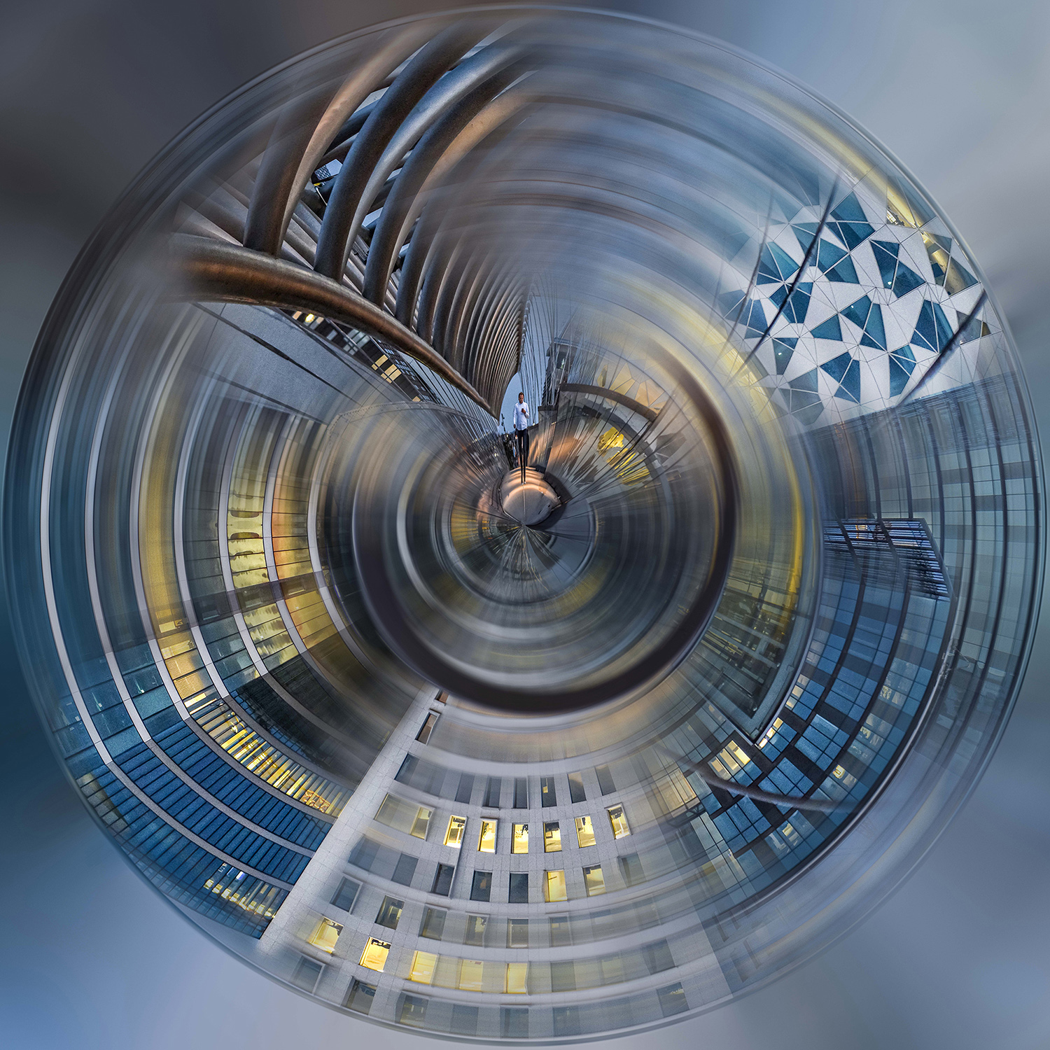 Digitally altered photography of a swirling urban scene with distorted buildings and metallic beams.